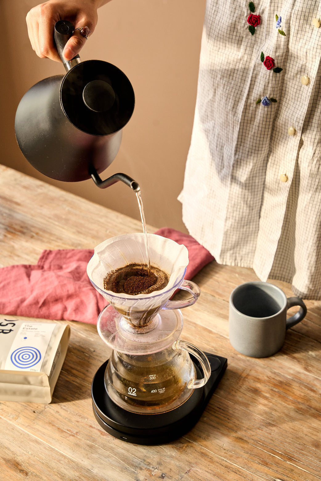 kettle pouring water on V60 coffee
