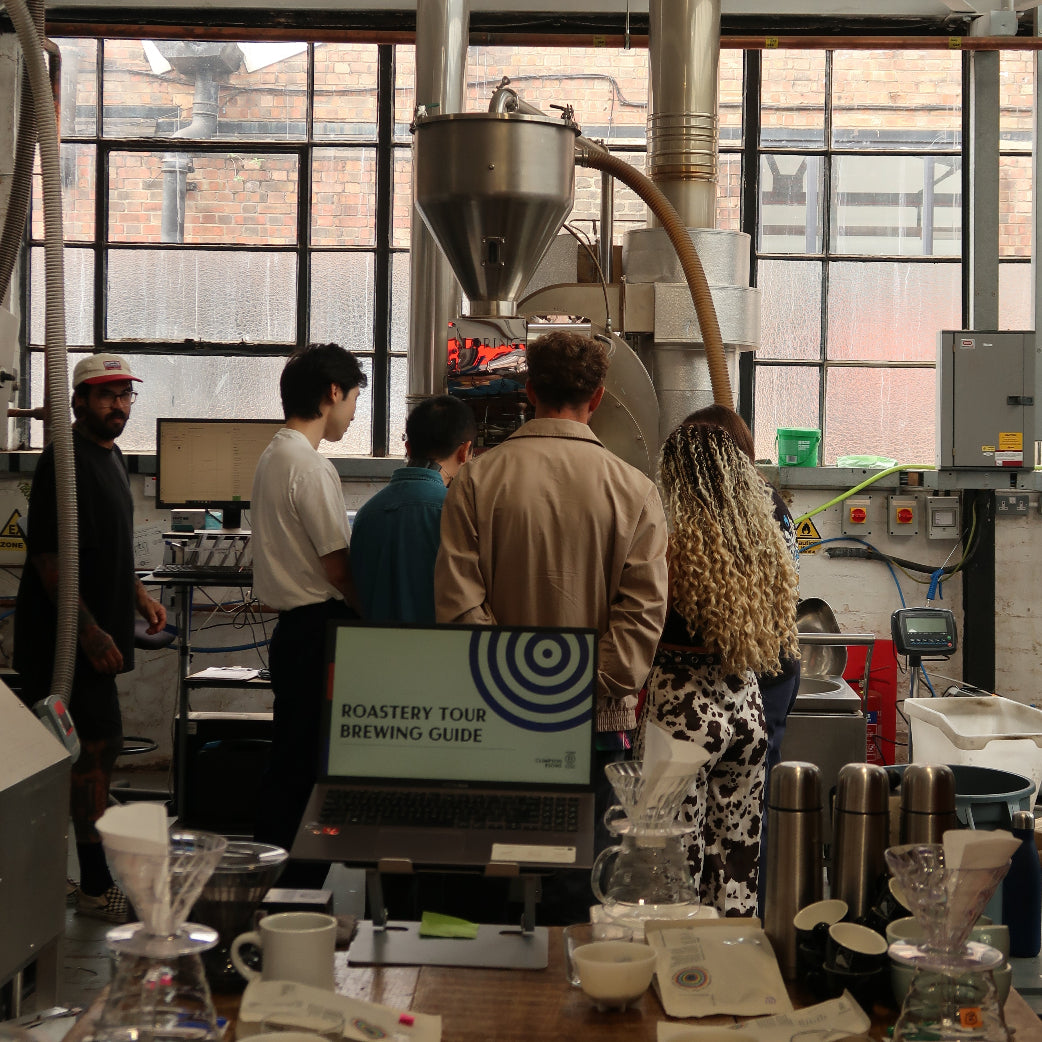People looking at roaster machine